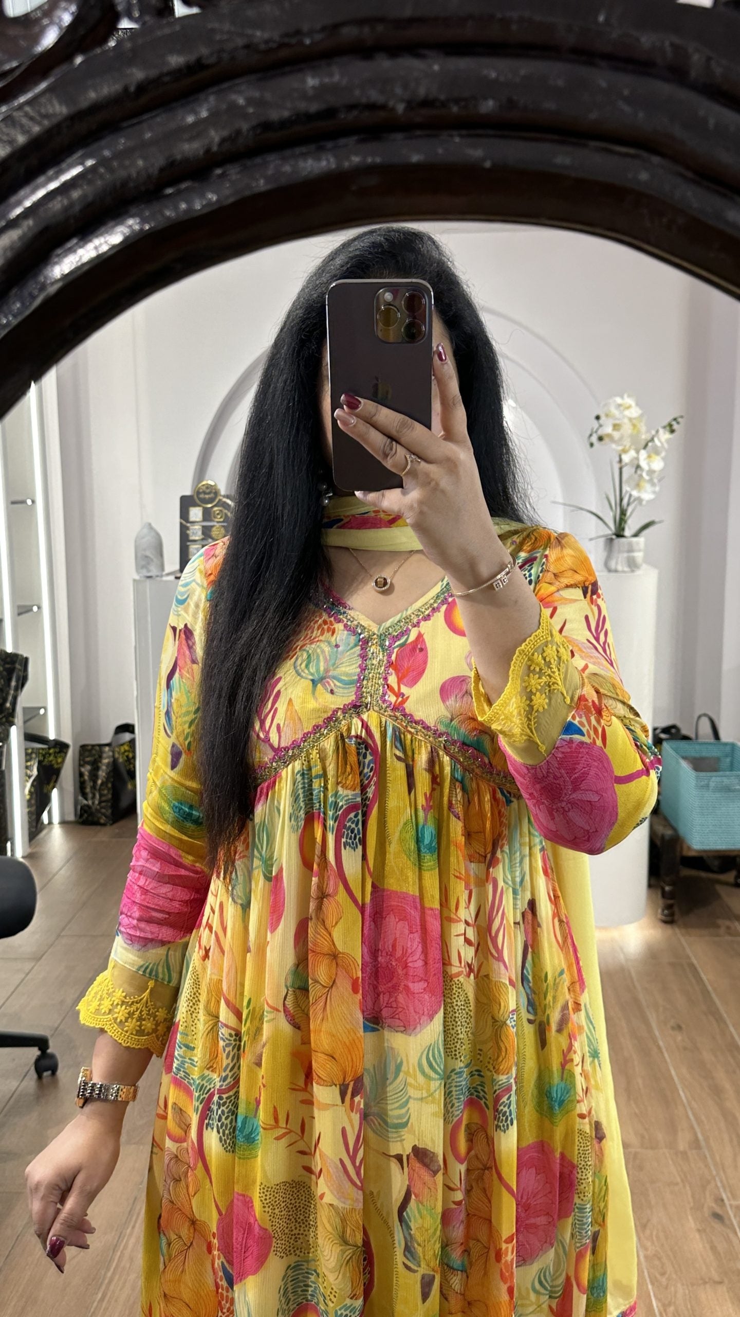 Yellow floral alia cut chinnon frock with embroidery detailing on the yoke
